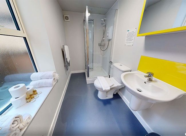 Bathroom with shower in 66 queens road apartment