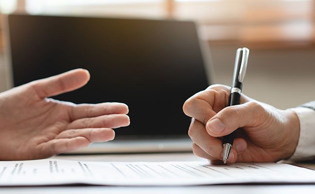 Landlord signing paperwork